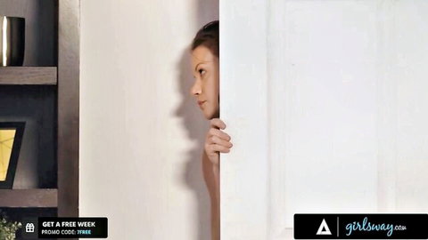 Whitney Wright peeking curiously from behind door in seductive Girlsway scene