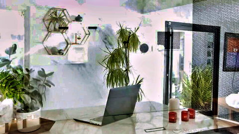 Elizabeth Skylar in stylish Nuru massage room setup with plants