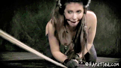 Gagged slave kitty in bondage, topless brunette kneeling for rough BDSM punishment