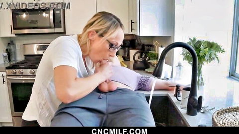 Blonde MILF landlady in glasses gives blowjob to tenant in kitchen