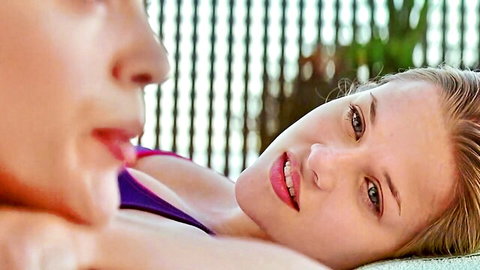 Reese Witherspoon lounging in purple bikini with Alyssa Milano close up