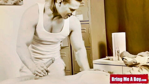 Muscular blonde masseur using dildo on nude twink during gay massage