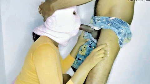 Sri Lankan masked woman giving blowjob to man in bedroom