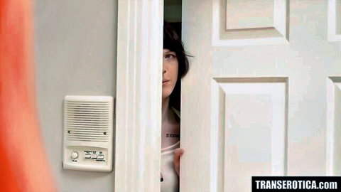 TS Autumn Rain peeking seductively from door in erotic massage preview