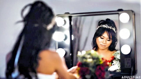 Ember Snow and Korra Del Rio in elegant bridal mirror scene