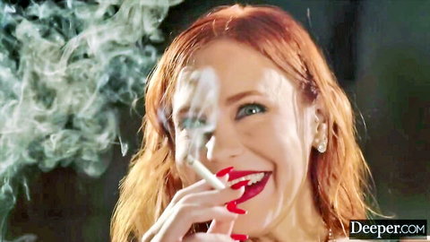 Maitland Ward redhead MILF smiles seductively with cigarette