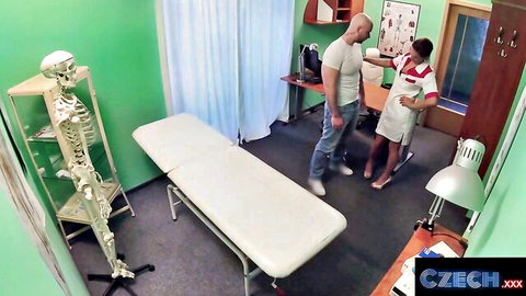 Sexy Czech nurse in tight red uniform flirts with muscular guy in hospital exam room