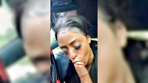 Ebony woman with glossy lips sucking massive BBC cock in car