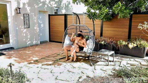 Tanned skinny woman with medium tits rides cock cowgirl in outdoor hanging swing chair