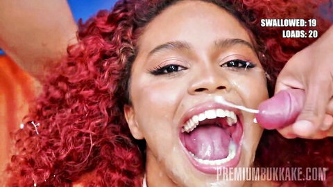 Redhead mixed beauty swallows 20 loads in bukkake cumshot scene