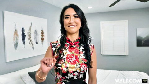 Isabel Love smiling in sexy floral cheongsam dress POV tease