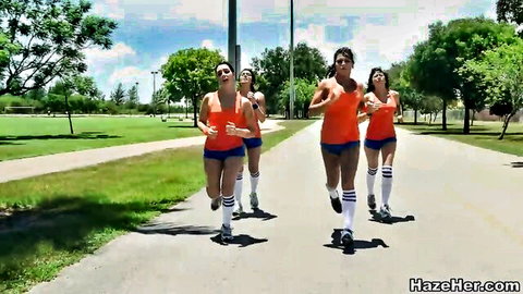 Four fit sorority girls jogging in sexy orange tank tops, shorts, and thigh-highs on HazeHer