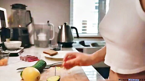 Busty Muslim mommy's huge tits and hard nipples poking through tight white tank top while chopping cucumber in kitchen