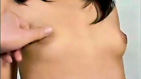 Elegant Asian MILF teasing small perky tits close-up