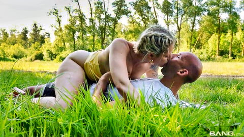 Mel Melicious passionately kissing black partner outdoors in yellow top