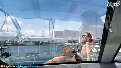 AngelsSex lounging in black bikini on sunny yacht deck