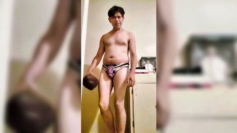 Maudau79 in colorful speedo, kinky solo pose showcasing physique