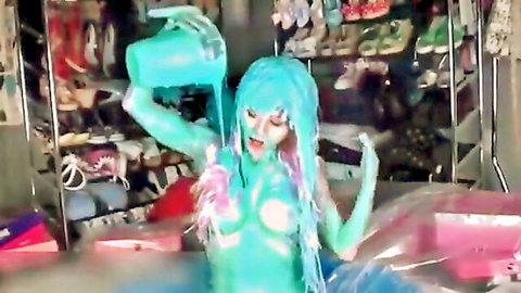 Teal-haired girl covered in green slime, nude and playful pose