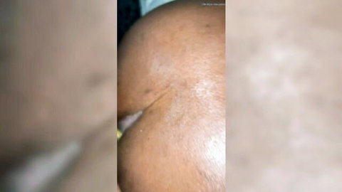 Close-up of ebony woman's exposed big ass and crack