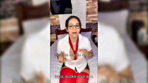 Mature Venezuelan woman in glasses and open white shirt teasing cleavage