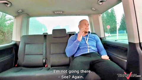 Bald man in tracksuit gesturing in van backseat, pierced tattooed babe car cock ride scene
