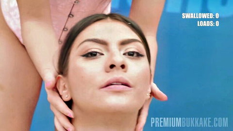 Brunette slut with hands gripping her head, mouth open ready for bukkake cum loads