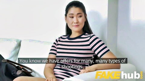 Asian female agent in striped top discusses offers with new model in casting