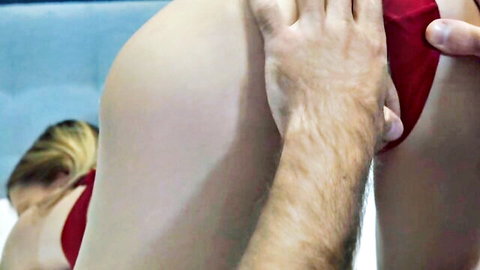 Blonde wife in red bikini bottoms groped by man from behind in cuckold scene