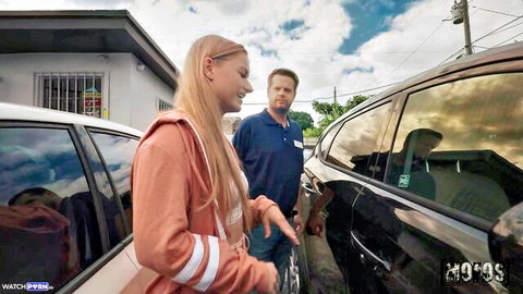 Blonde McKenzie Mae posing sexy in hoodie by car outdoors