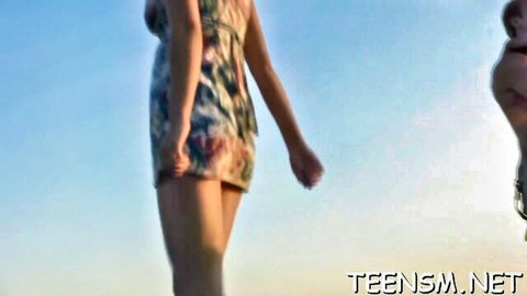 Vlaska in short floral dress outdoors with baby, teasing vibe