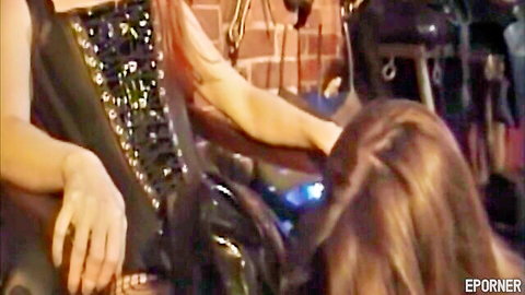 Redhead dominatrix in black corset fingers brunette submissive's pussy in BDSM play