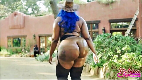 Thick ebony BBW walks away showing massive fat jiggling ass cheeks in tiny thong outdoors