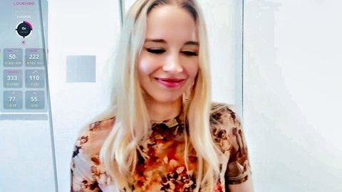 Petite blonde teen webcam girl smiles in sheer floral top teasing small perky tits