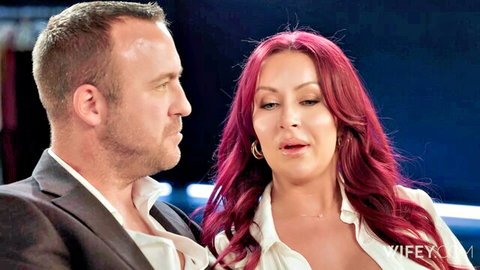 Zoe Grey redhead hotwife in low-cut white blouse with suited man