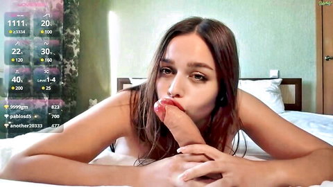Brunette webcam babe with big tits sucks thick dildo deeply on bed
