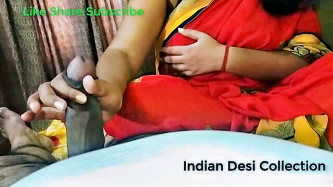 Indian woman in red saree grips thick dark cock with hand and foot handjob footjob