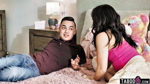 Korean teen Kimmy Kimm in pink top chatting with stepcousin on bed