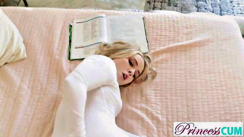 Haley Spades blonde in white top, lying seductively on bed with open mouth