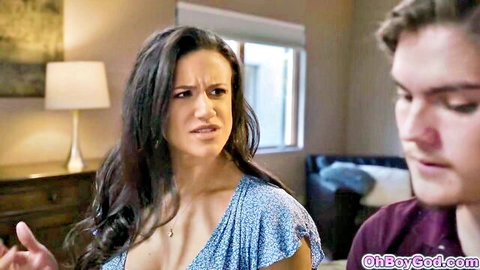 Brunette MILF stepmom in cleavage dress confronts young stepson on couch