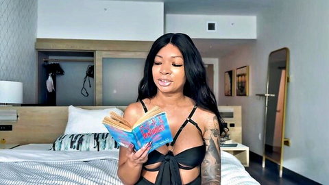 Eva Parker reading seductively in black lingerie, ebony story time tease