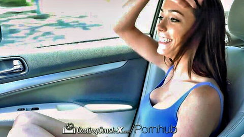 Ashly Anderson smiling in car with deep cleavage in blue top, agent touching