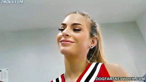 Sydney Cole as blonde cheerleader smiling seductively
