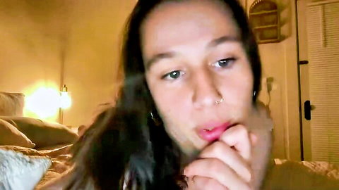 Naughty teen babe seductively bites plump lips with finger on webcam tease