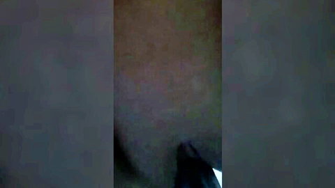 Extremely dark and blurry shadowy scene with no visible details or action
