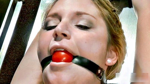 Aurora Snow blonde with red ball gag in BDSM restraint