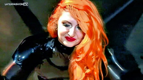Sarah Kavaii in shiny black latex bondage outfit, seductive redhead