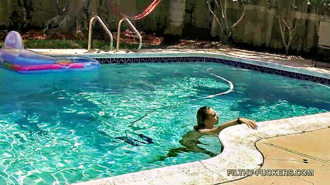 Alessia Luna floating relaxed in backyard pool, nude tease