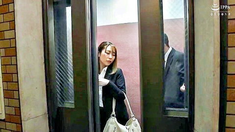 Hachino Tsubasa in tense elevator glance with suited man, JAV office affair preview