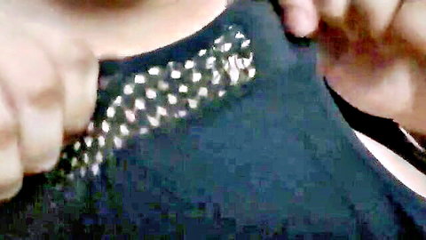 Maddy exposing her big tits and soft belly in studded black top