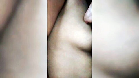 Close-up of dark pointy tasty nipples on pale skin